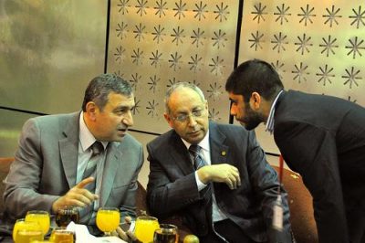 Egyptian Prime Minister Essam Sharaf (on left) confers with advisors; photo by Nabil Omar via flickr