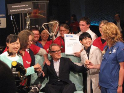 Nurses check up on Bill Nighy after his endorsement of the Robin Hood Tax. Photo by Sarah Anderson.