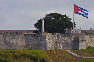 A Cuban flag flies over Havana Harbor. Photo by Ed Yourdon.