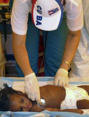 A Cuban doctor treats a Haitian child sick with Cholera. Acts of good will are key to Cuba&#039;s diplomatic styrategy. Photo by The Independent.