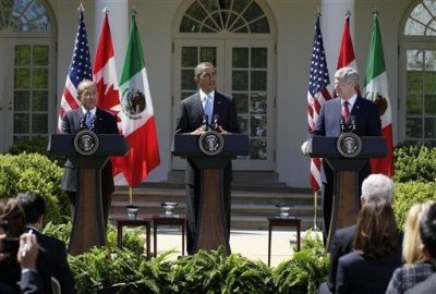 arack Obama, Felipe Calderon and Stephen Harper. AP photo.