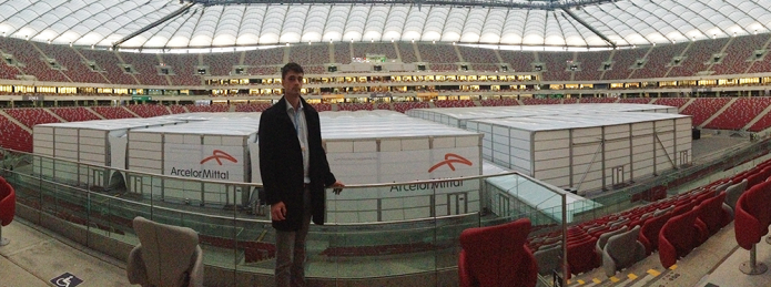 Robbie Watt in front of COP19&#039;s plenary session boxes, sponsored by the corporation ArcelorMittal