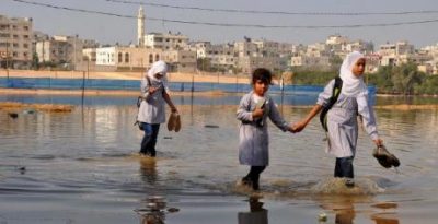 Gaza schoolgirls wade through sewage