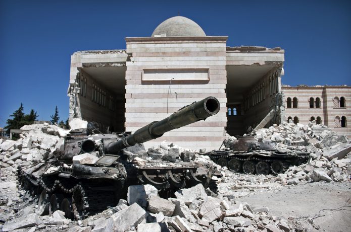 Destroyed tanks in front of a mosque in Azaz, Syria.