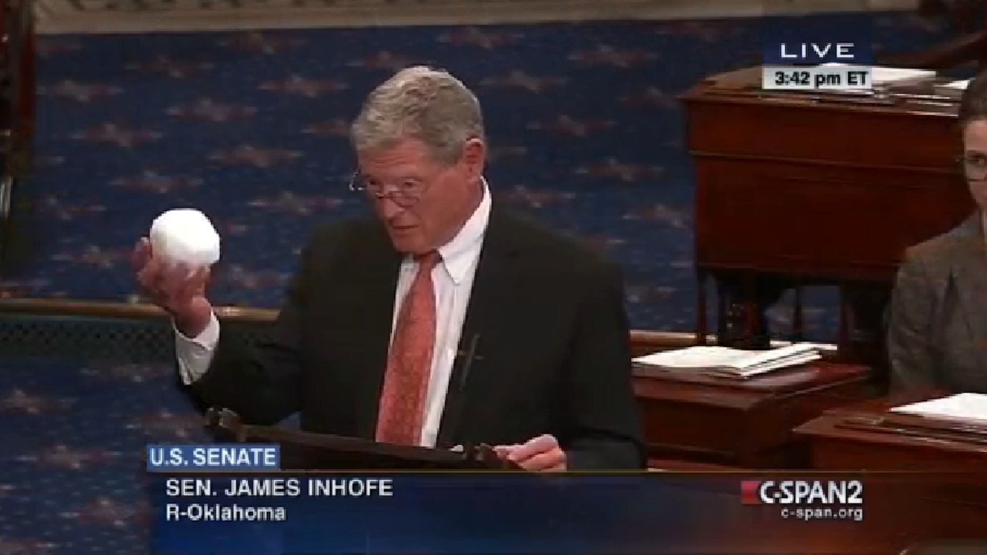 Sen. Inhofe 'disproving' climate change by dropping a snowball on the Senate floor.