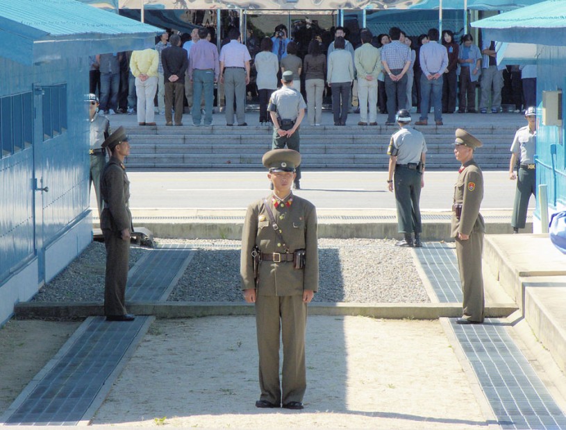 North Korean soldiers stand at DMZ side of border