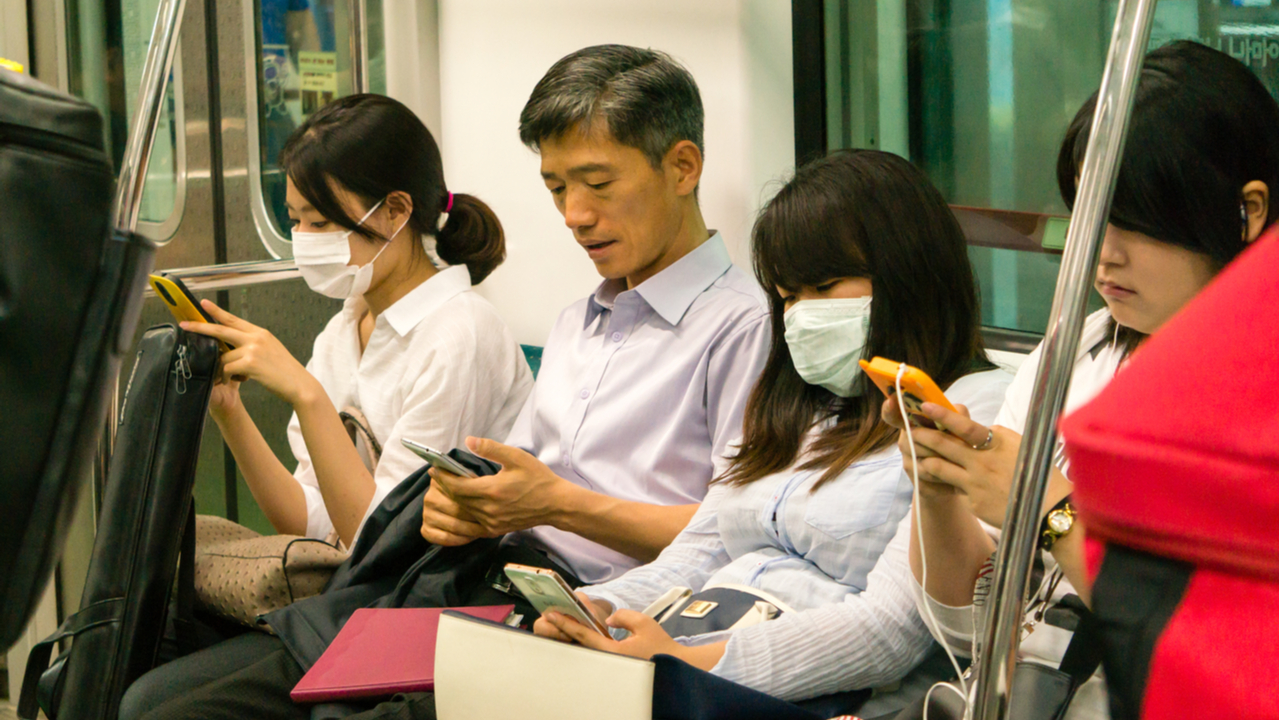 people sitting on a train during the coronavirus