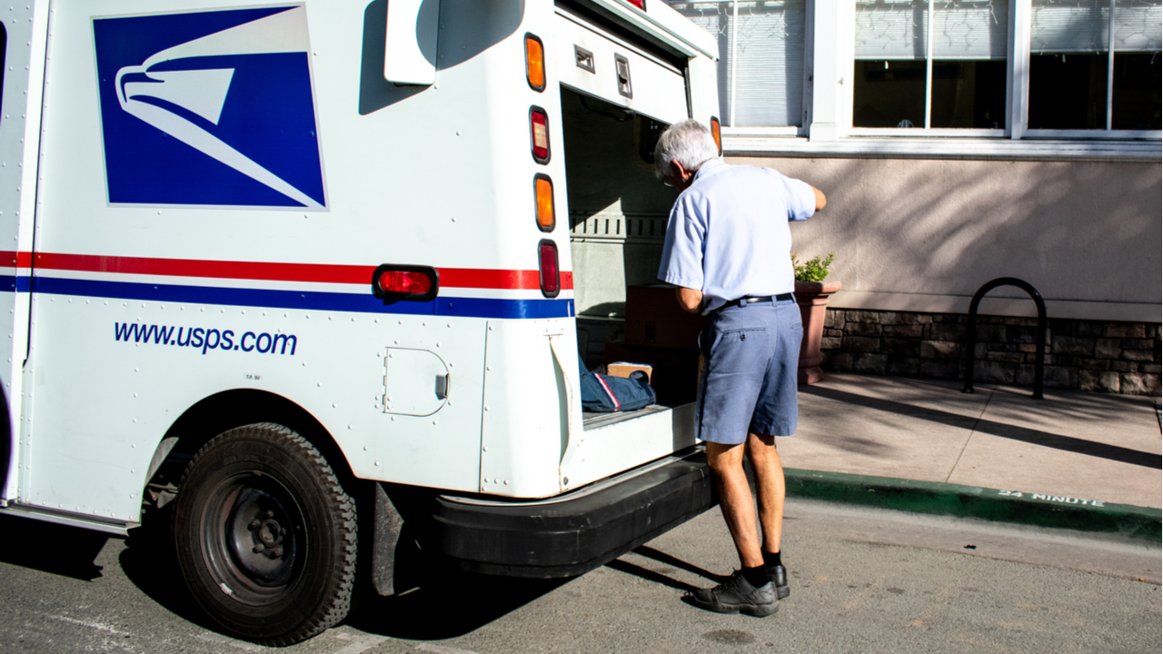 A United States Postal Service delivery worker.