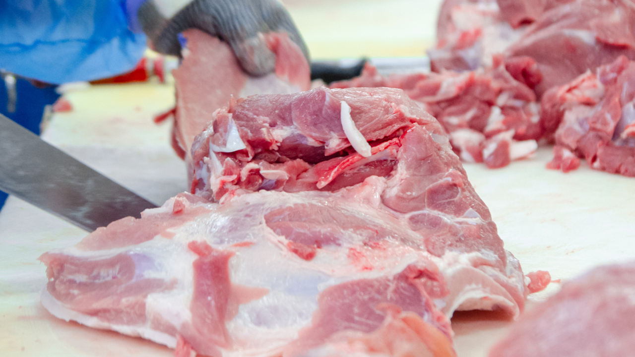 Butchers are cutting pork