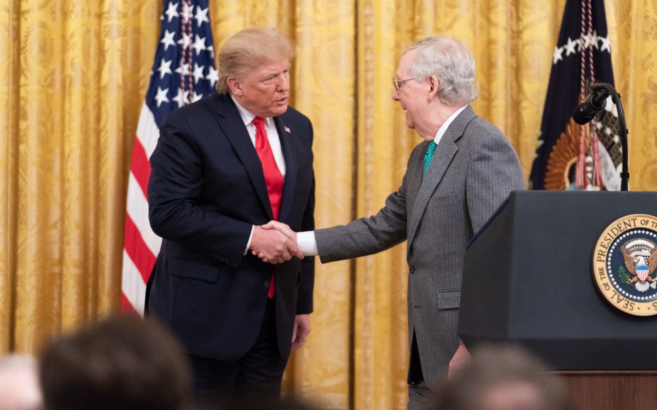 failed covid-19 stimulus package - trump and mcconnell shake hands