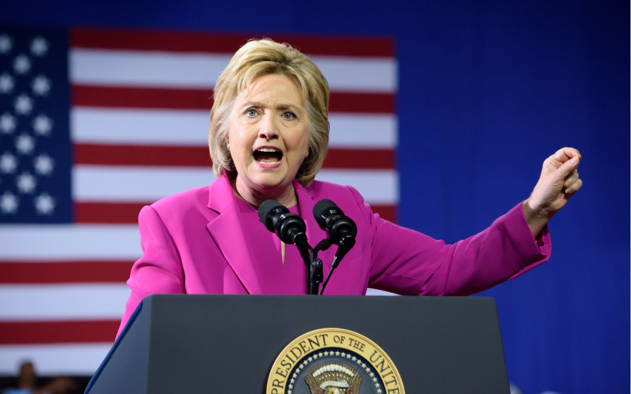 Hillary Clinton makes a pointing gesture as she delivers a speech at a campaign event with US president Barack Obama