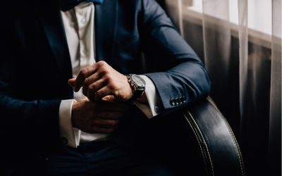 man wearing luxury attire, suit, and watch