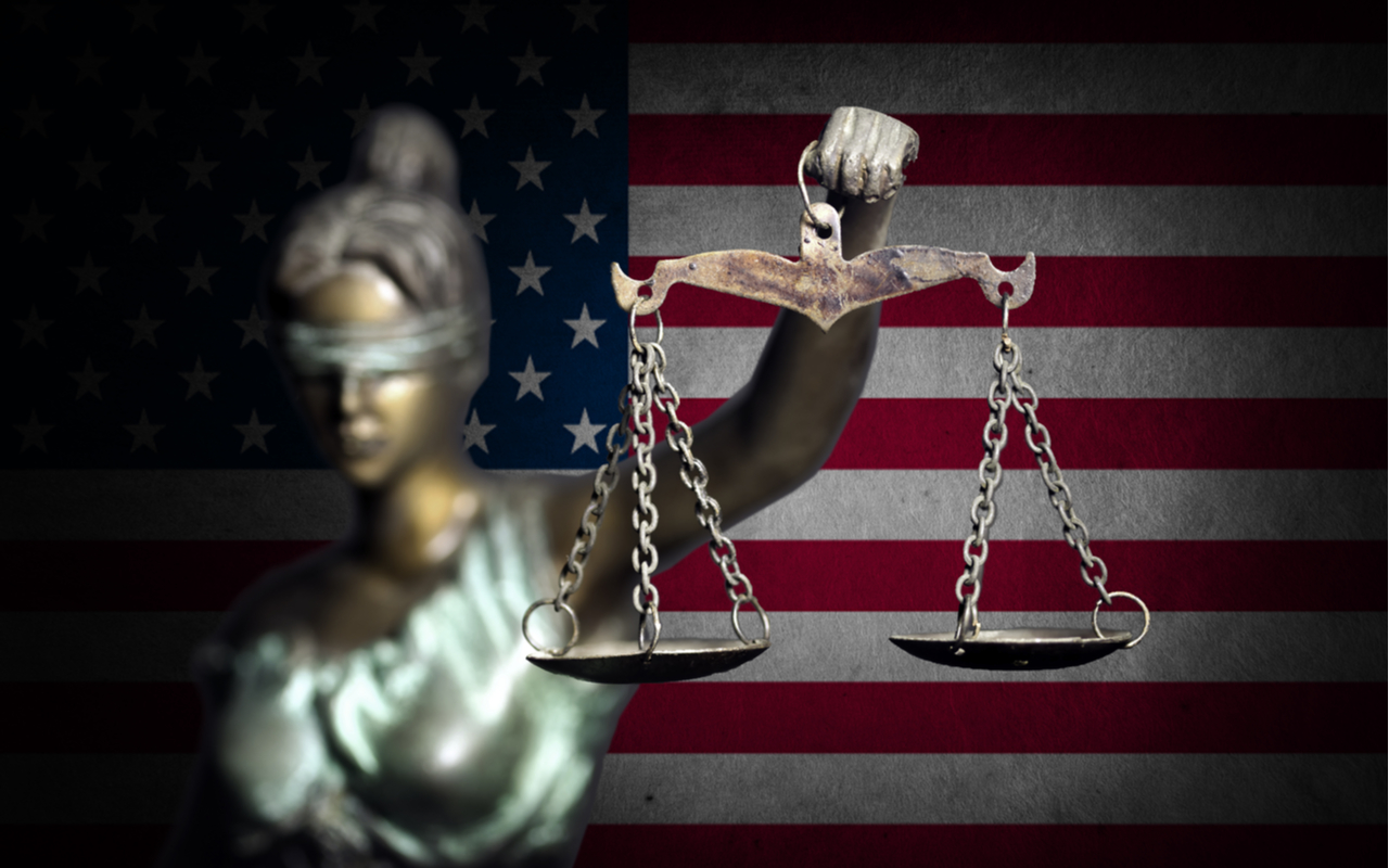lady justice holding up scale depicting inequality
