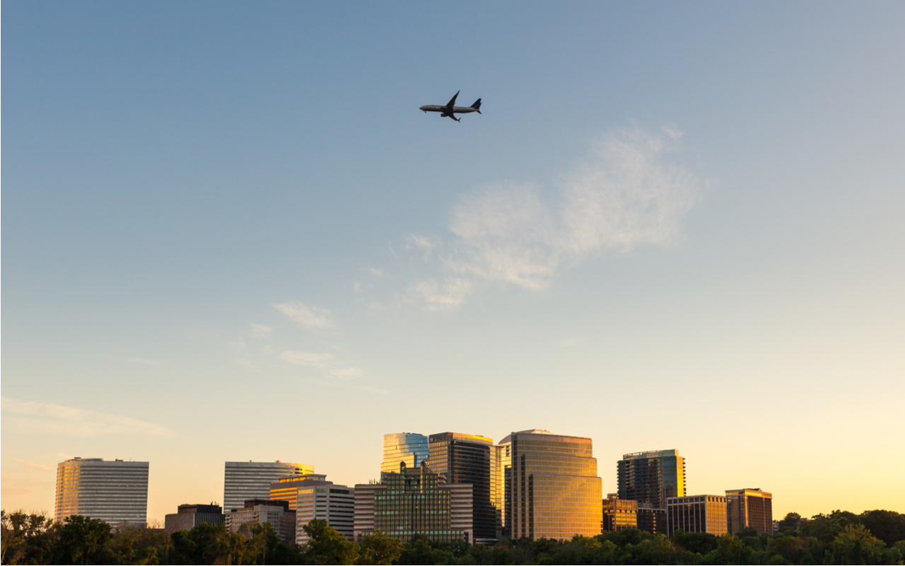 plane flying over office buildings in Arlington, Virginia