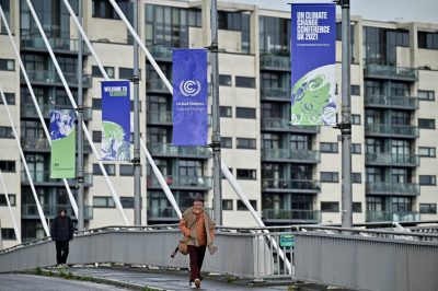 man walking during cop26 in glascow during climate conference