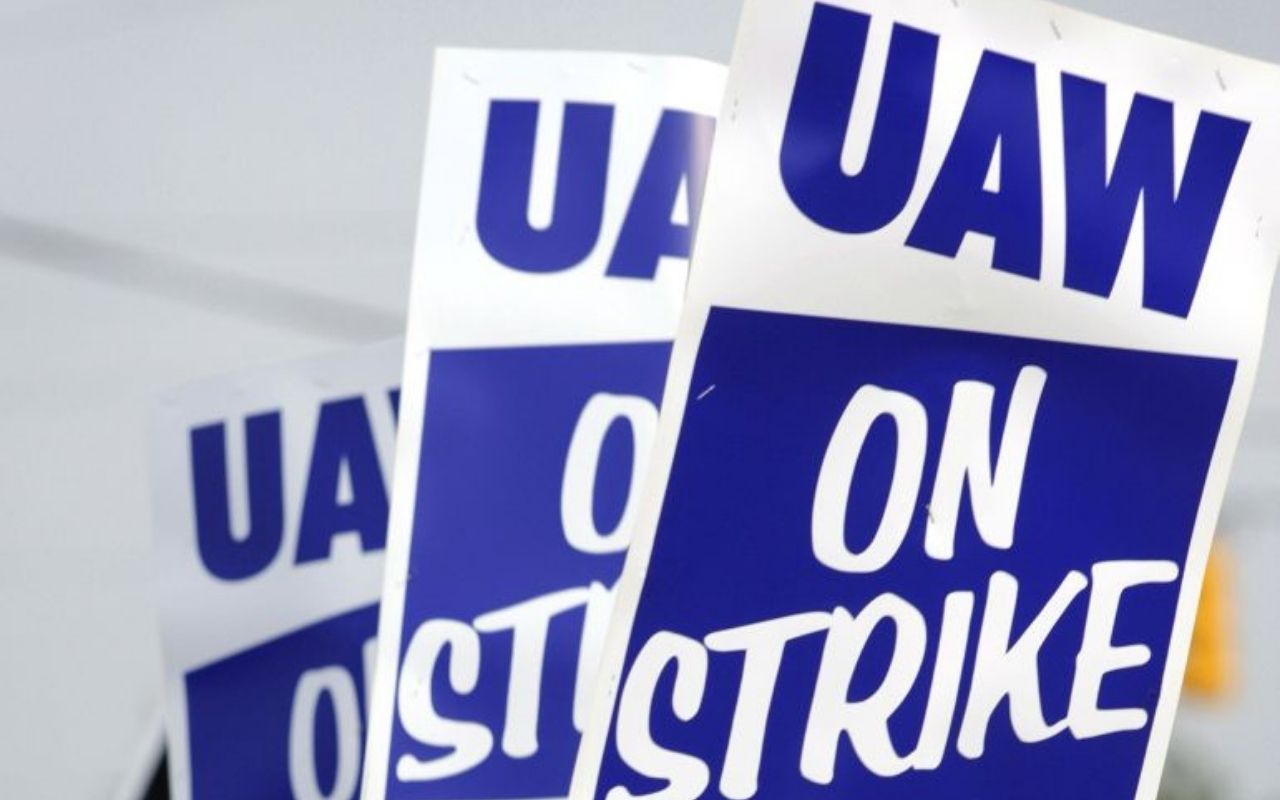 uaw signs at a columbia student workers strike