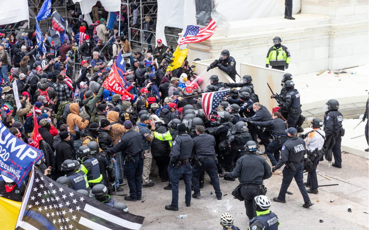 January 6, 2021- Pro-Trump protesters and police clash on top of the Capitol building