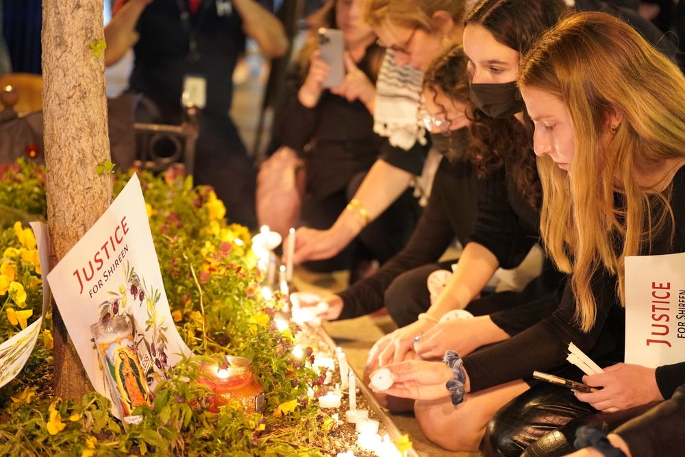 Mourners hold a vigil for the slain Palestinian American journalist Shireen Abu Akleh outside the National Press Club in Washington, D.C.
