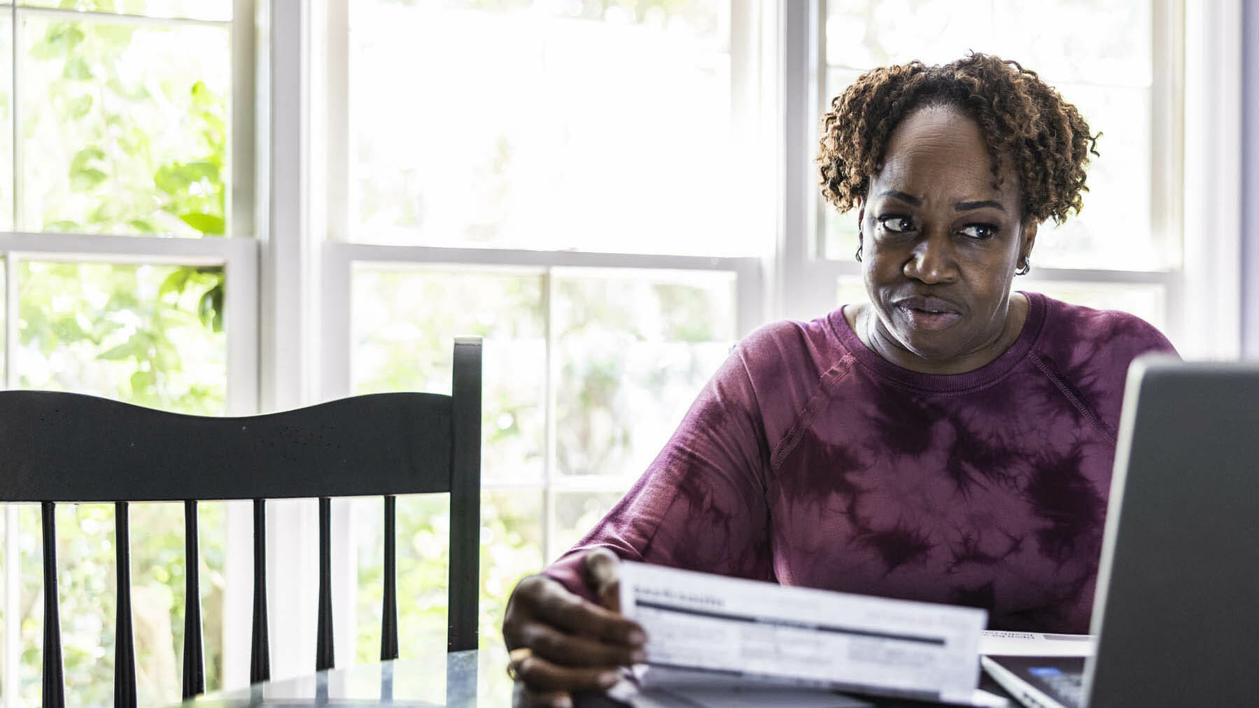 woman looking at social security retirement documents