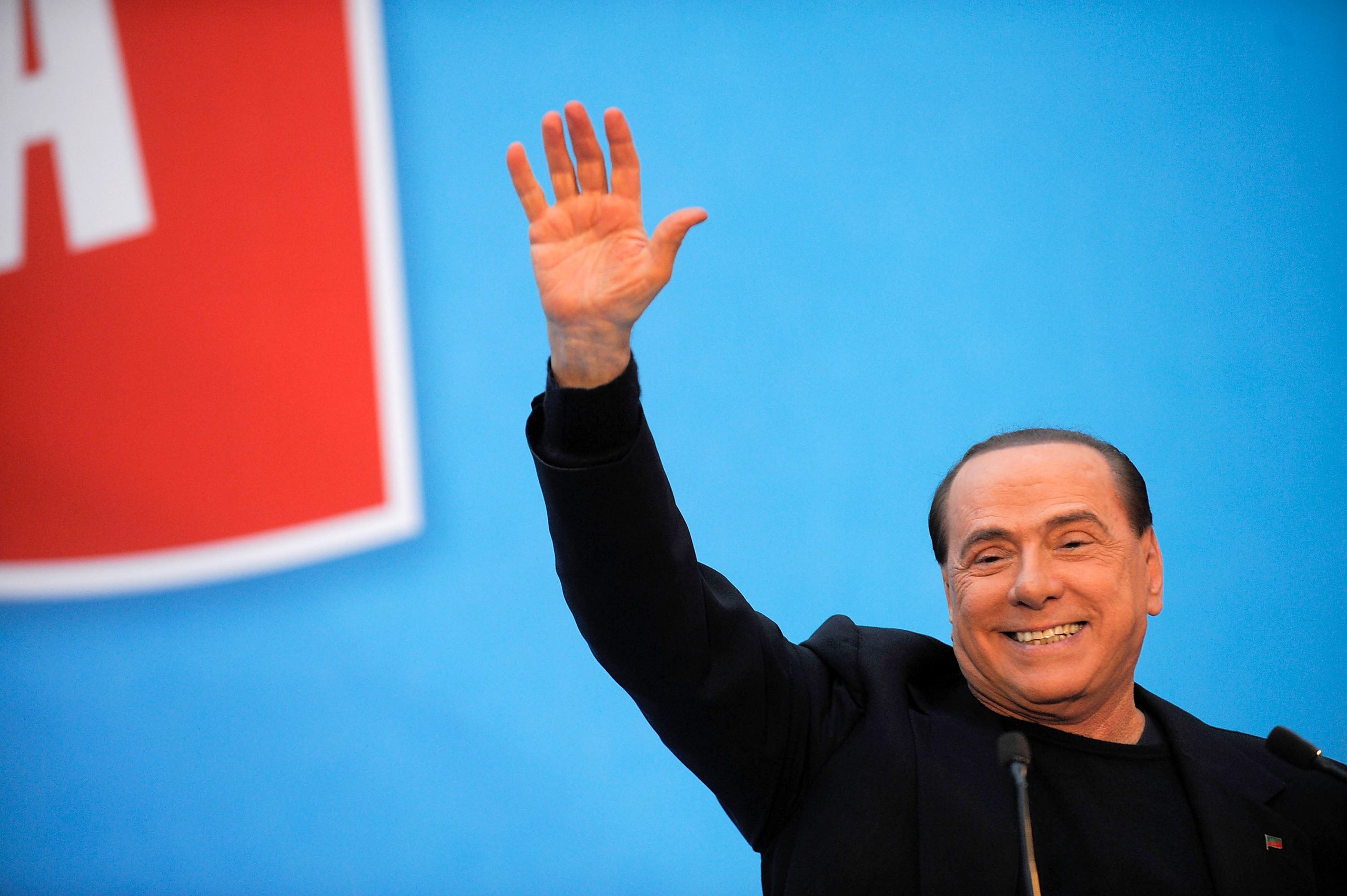 ROME, ITALY - NOVEMBER 27: Former Italian Prime Minister Silvio Berlusconi gestures as he attends a rally outside his house, Palazzo Grazioli, on November 27, 2013 in Rome, Italy. The Italian Senate has today voted to expel former Prime Minister Silvio Berlsuconi from parliament after his recent conviction over tax fraud.